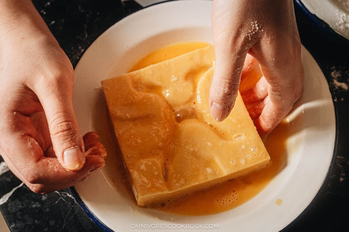 dipping the patty in beaten egg