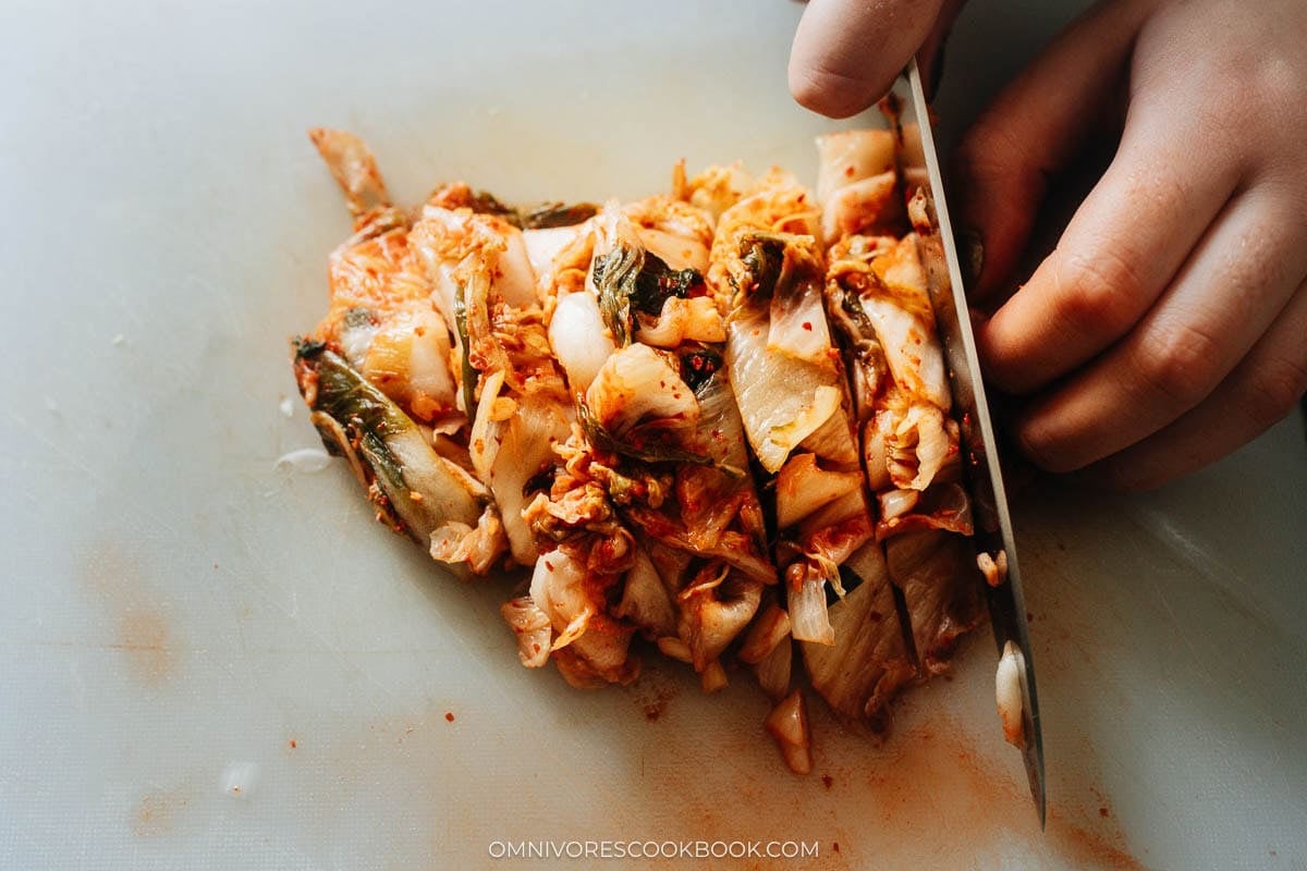 chopping the kimchi