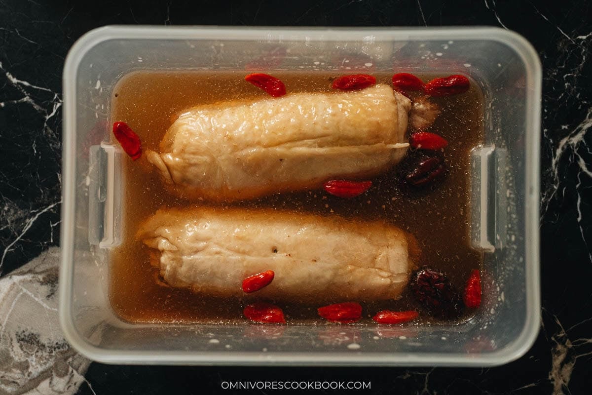 soaking the chicken rolls in a container