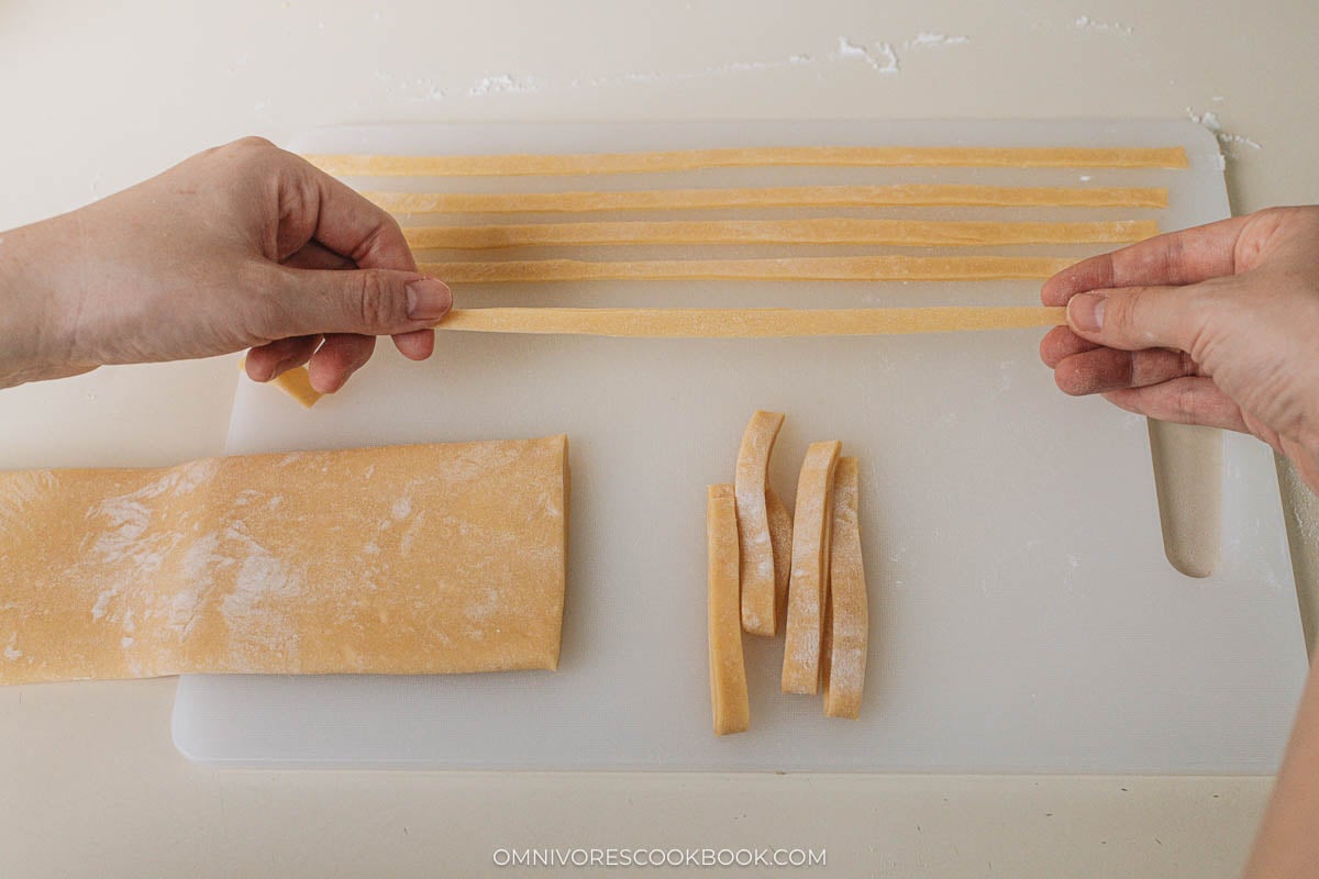 Gently stretch the noodles to even them out.