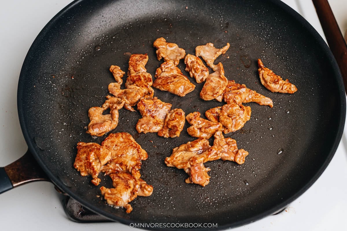 Cook sliced pork in a pan