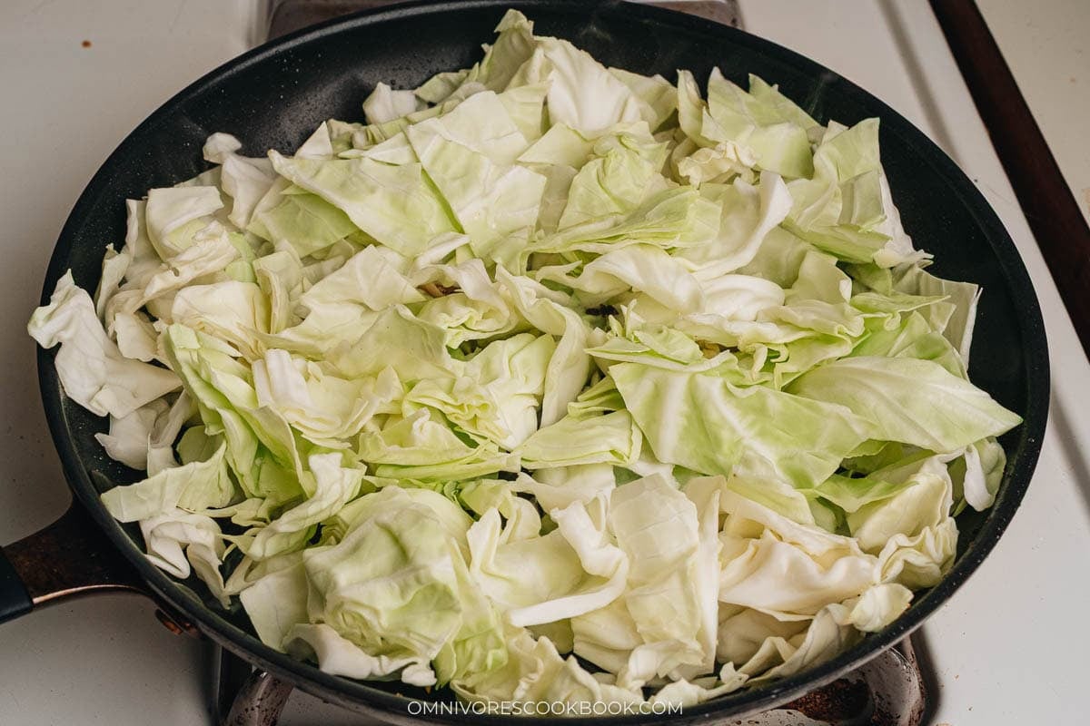 Stir frying cabbage in a pan