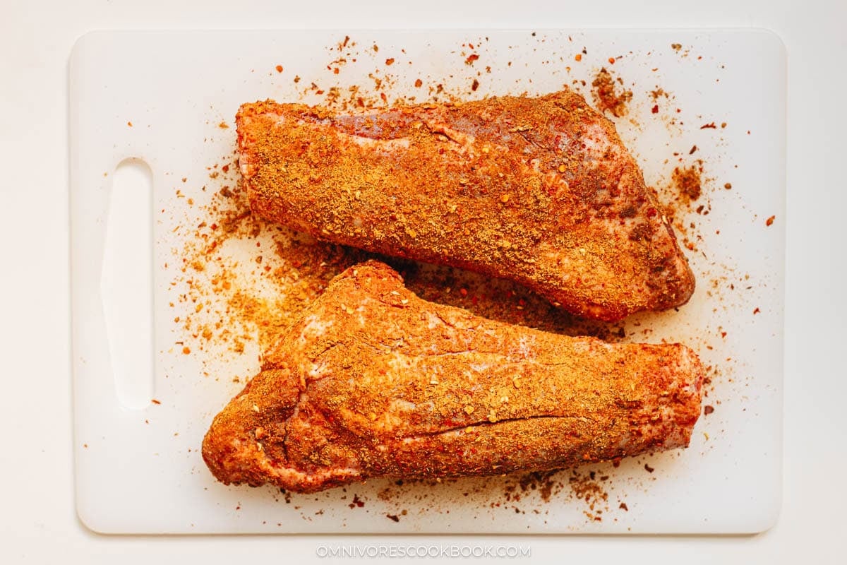rubbing spices on shank