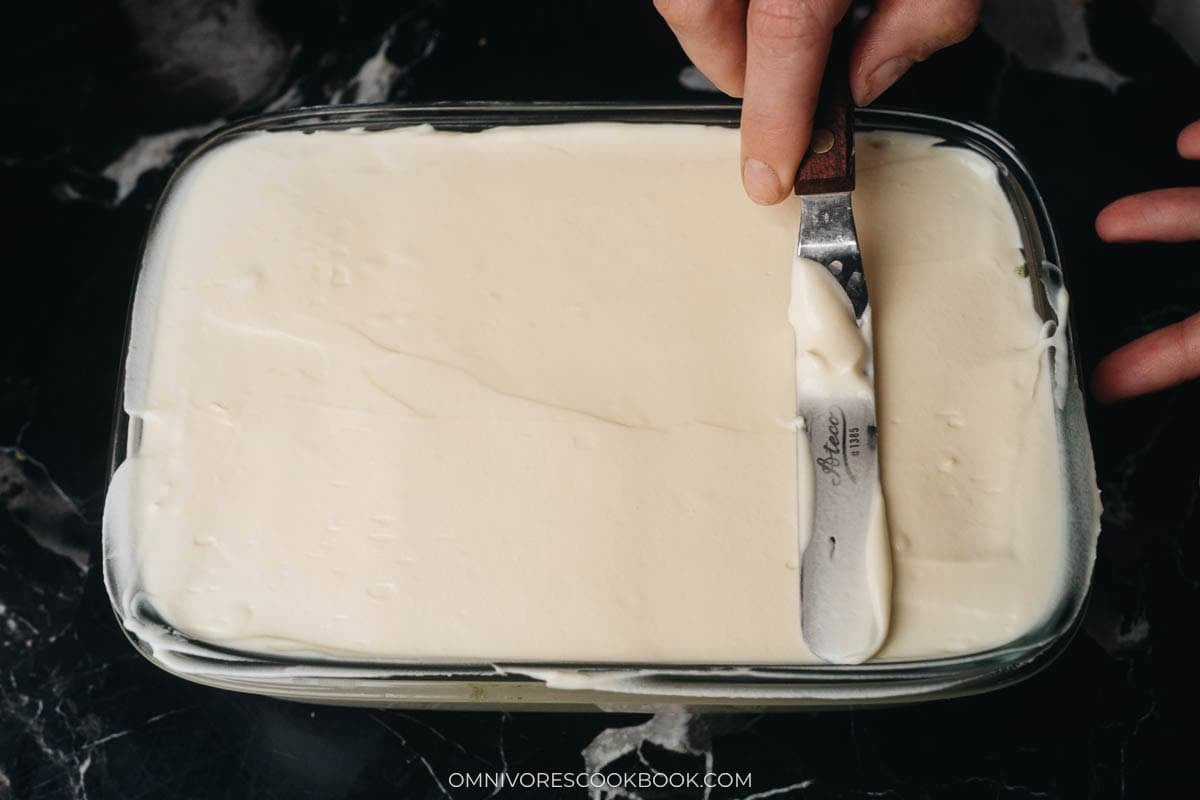 covering with the remaining cream and smooth the top