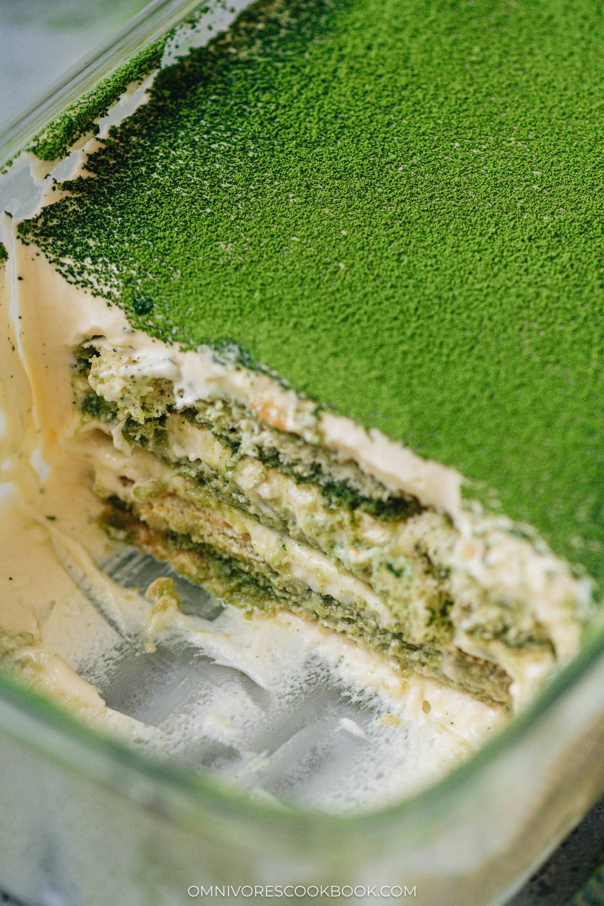 Sliced matcha tiramisu in a baking dish