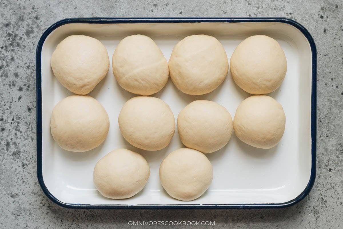 divided dough ball resting on a tray