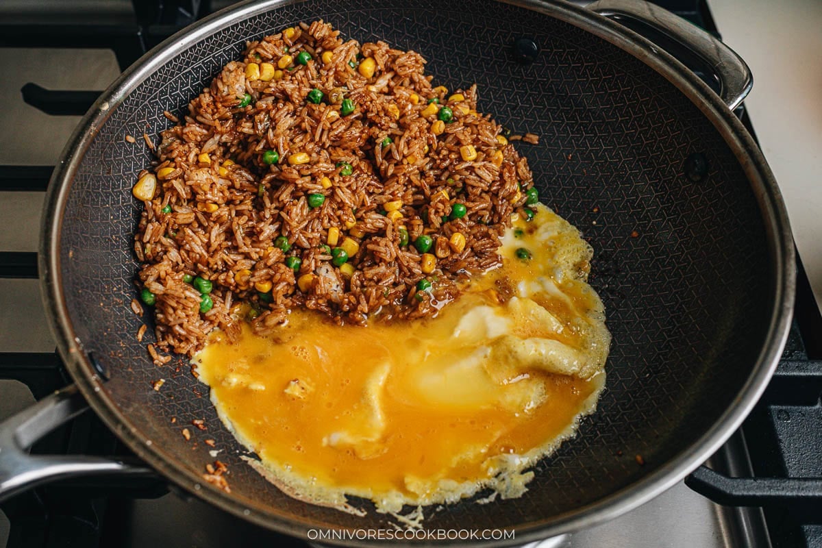 Scrambling the eggs on a side pan