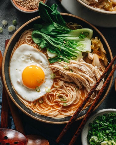 Korean noodle soup topped with egg and baby bok choy