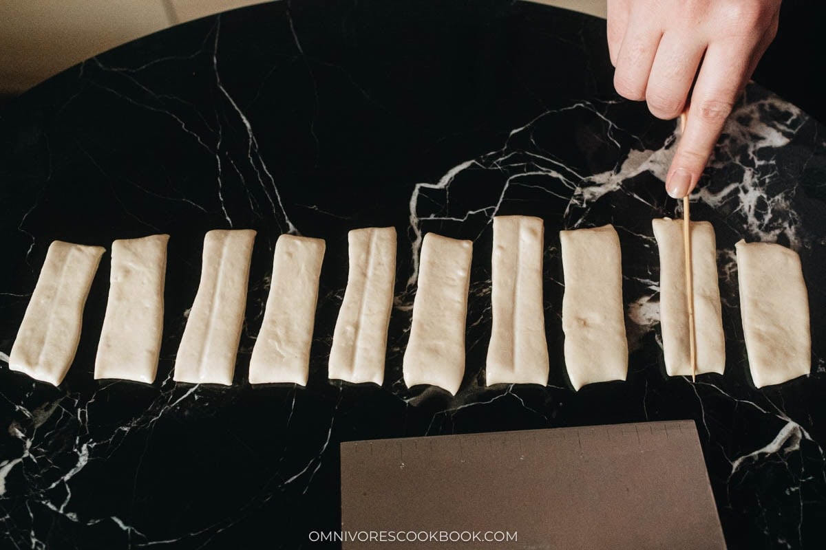 Press half of the rectangles with a skewer