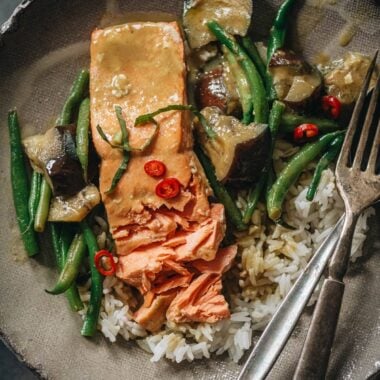 Thai salmon coconut curry serve on a plate with rice