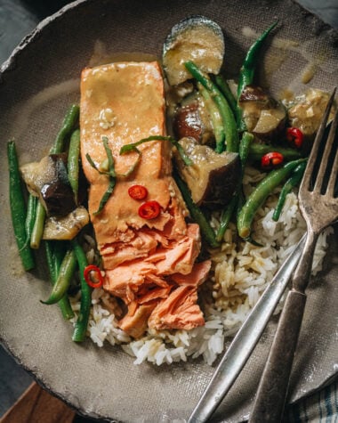 Thai salmon coconut curry serve on a plate with rice