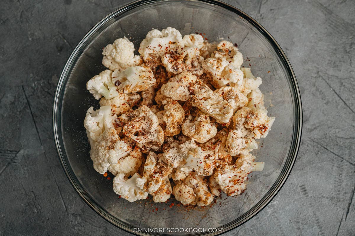 Toss the cauliflower with oil and spices in a big bowl