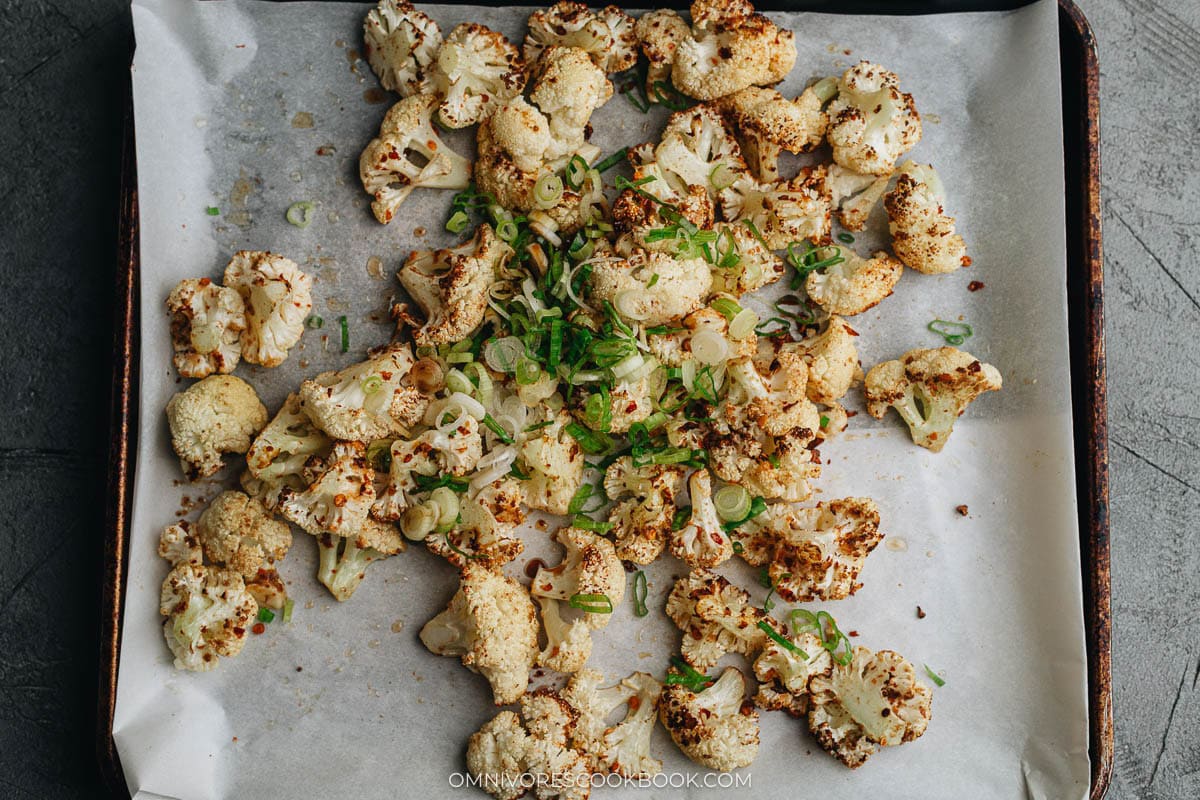 Add the green onion and soy sauce to the cauliflowers