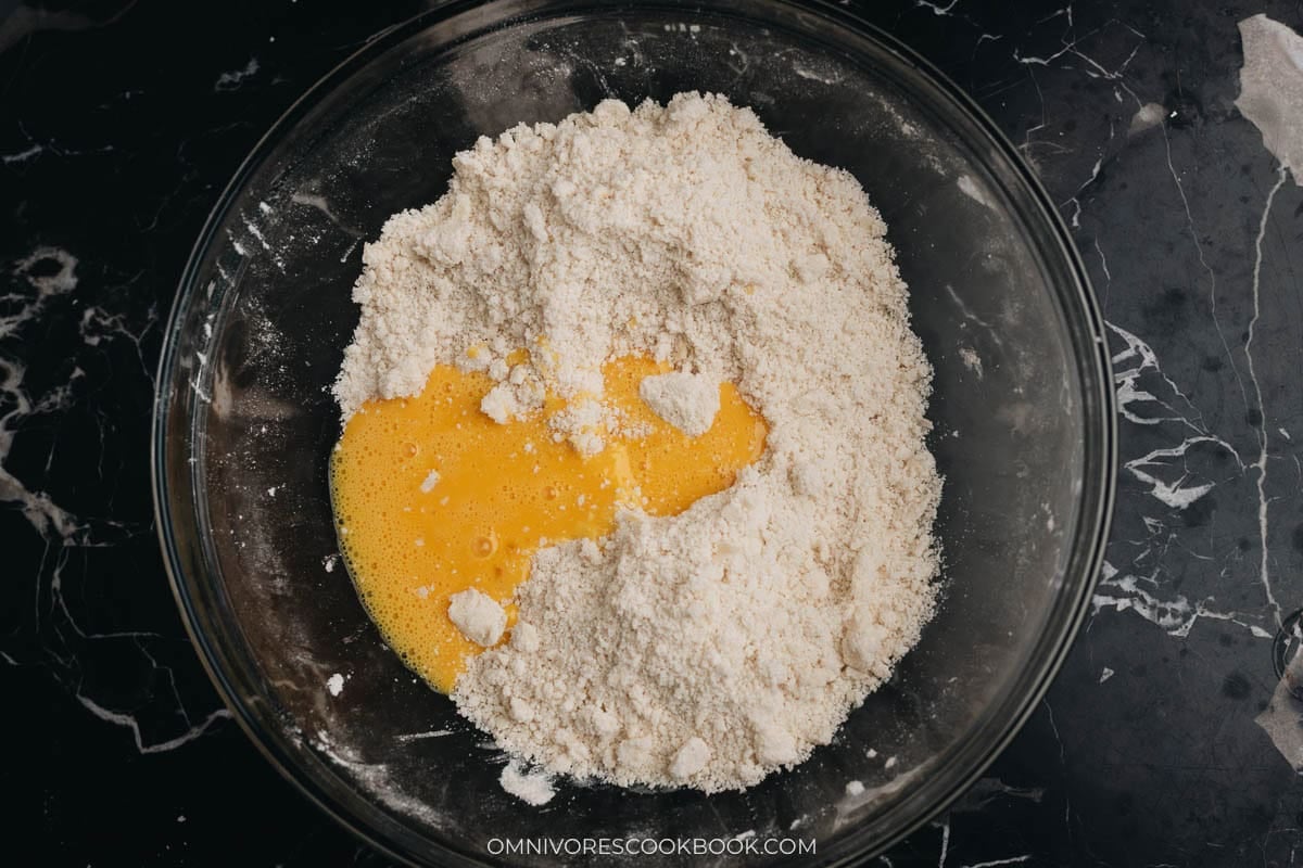 Add the egg to dry mixture