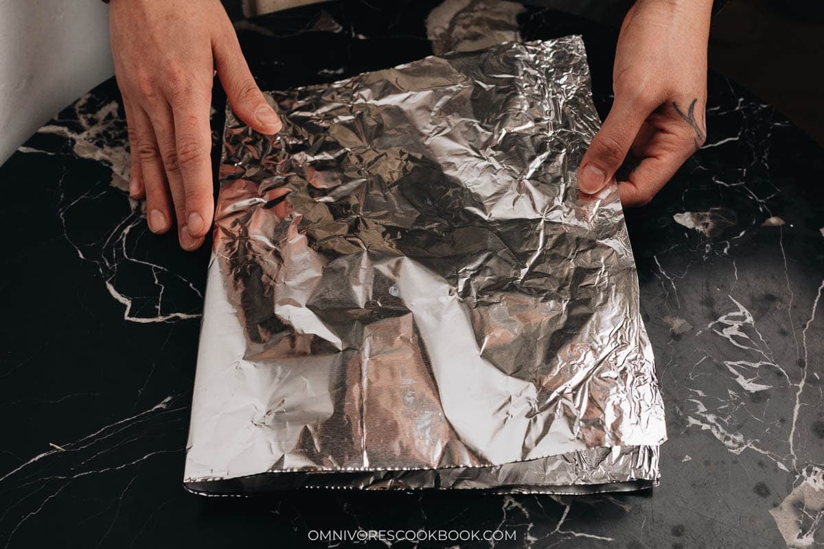 Fold a large piece of foil twice so the pan will be sturdy