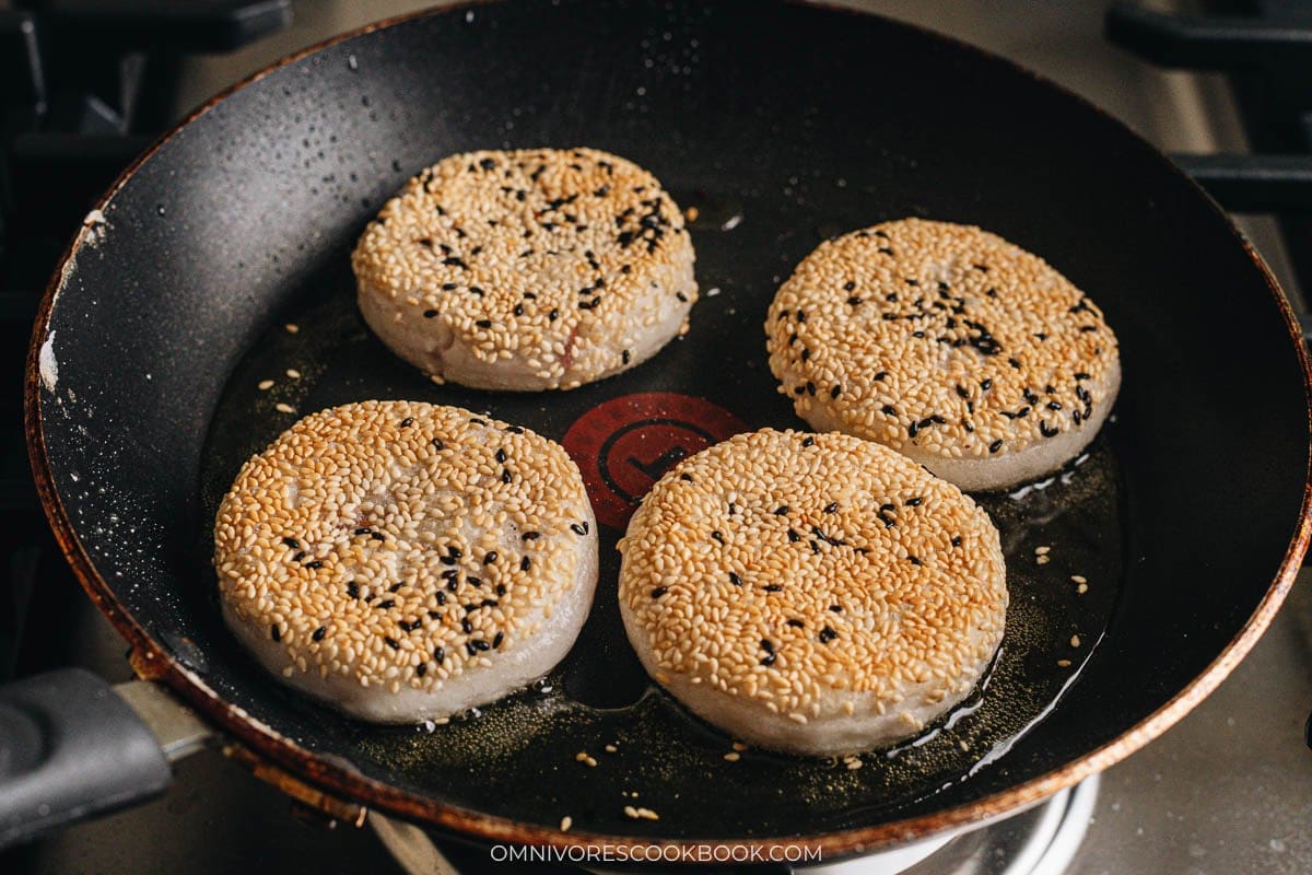 cooking the rice cakes in a skillet