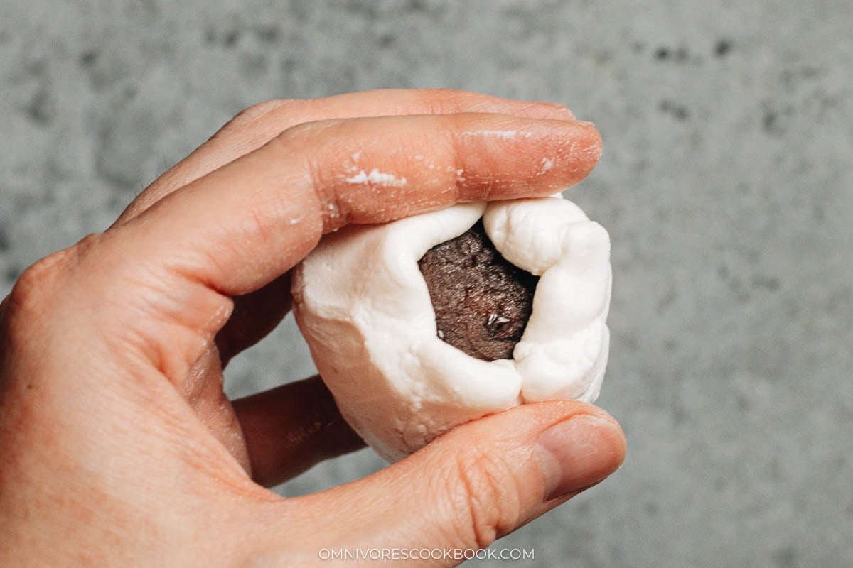pinching the edges of the dough