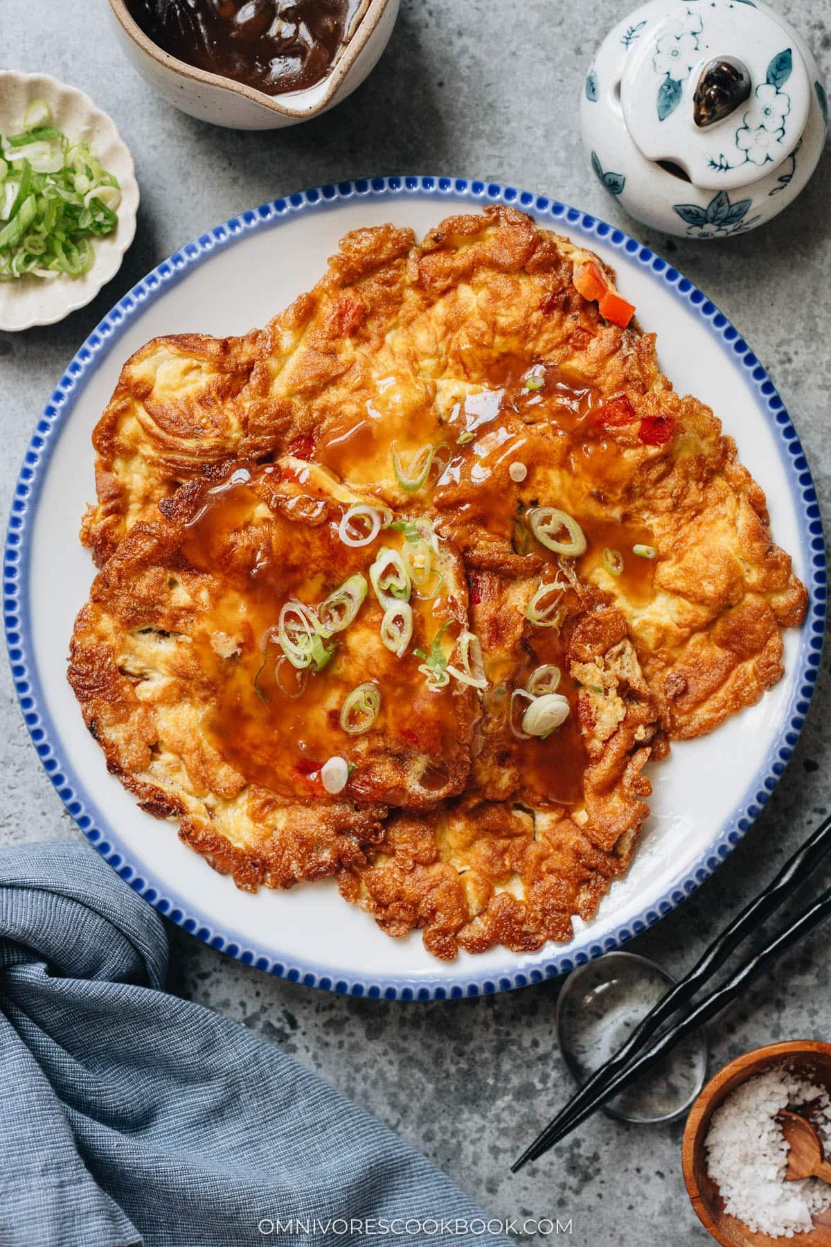 Egg foo young served with rice and veggies with gravy