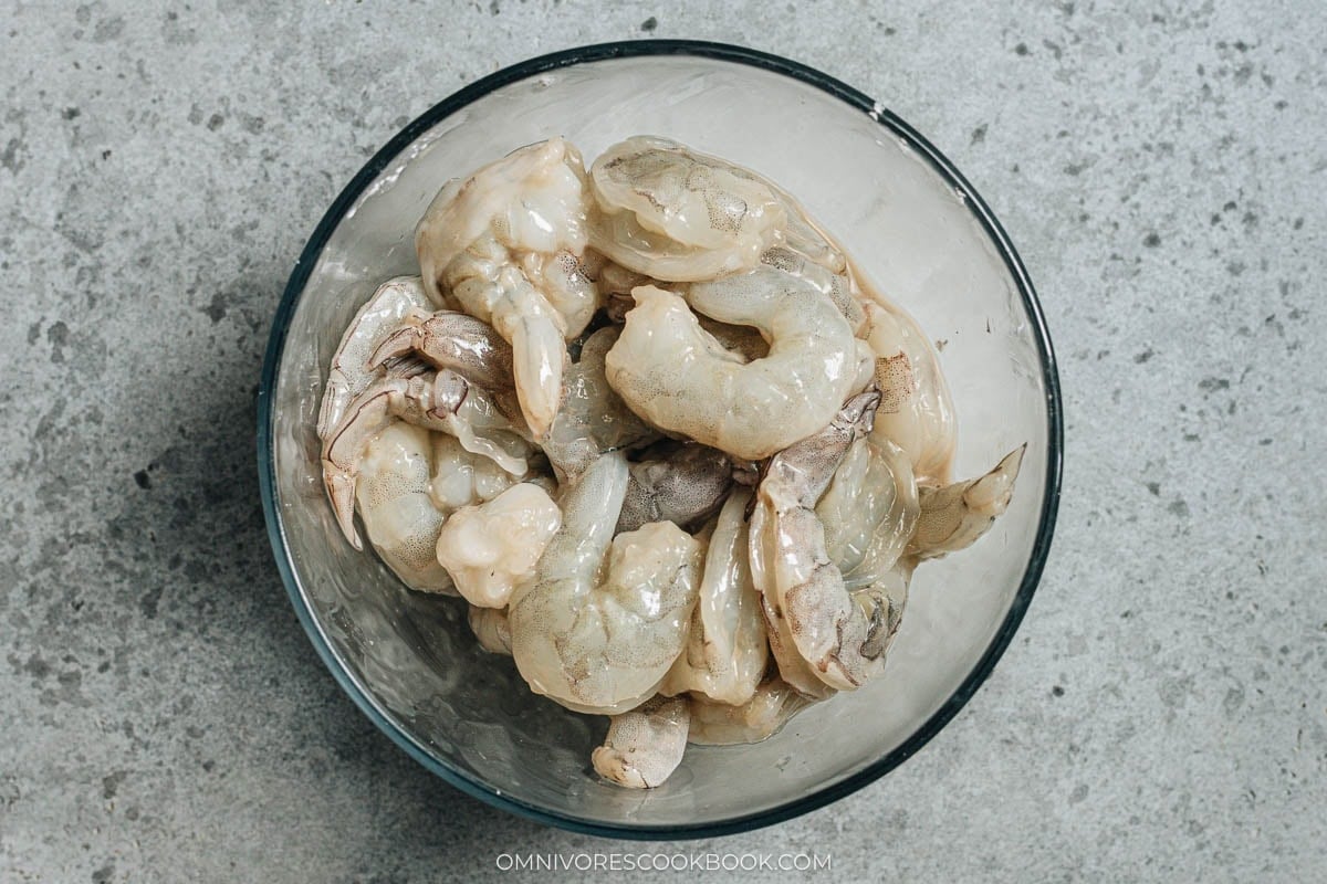 marinating the shrimp in a bowl