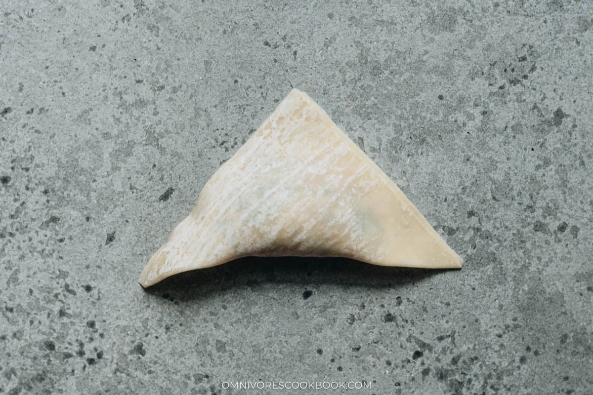 folding wrapper into a tringle