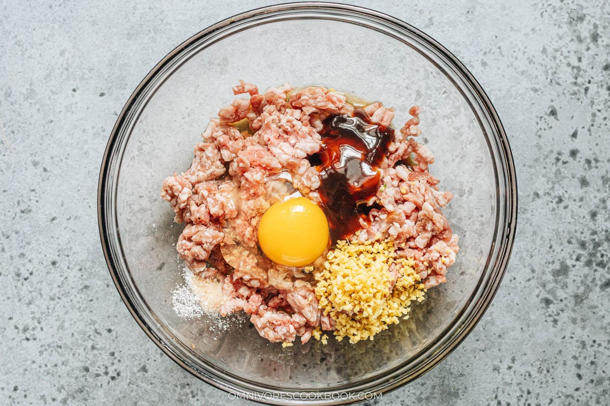 mixing the pork filling in a bowl