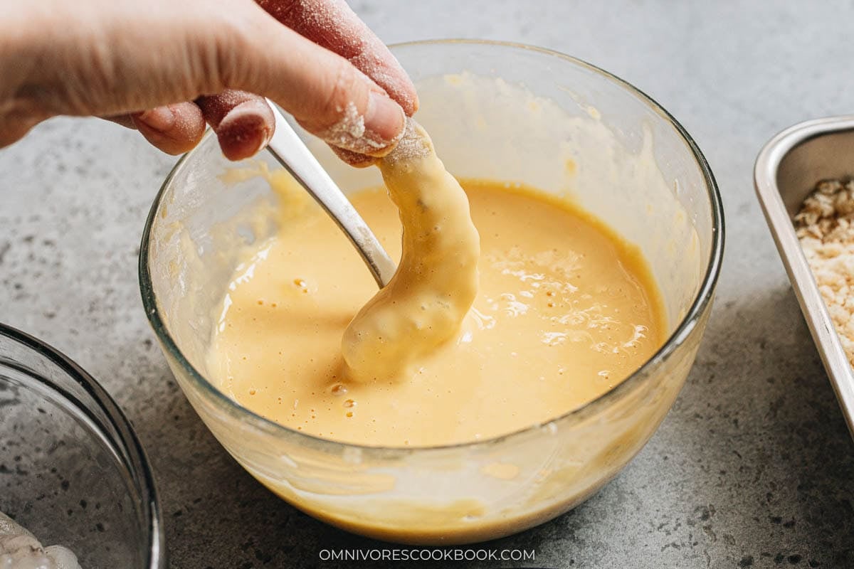 coating the shrimp with egg mixture