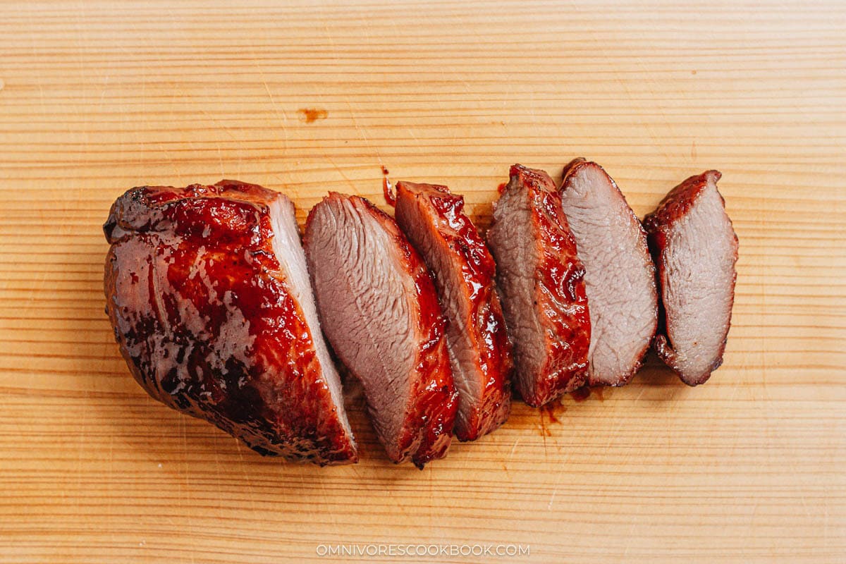 char siu sliced on cutting board