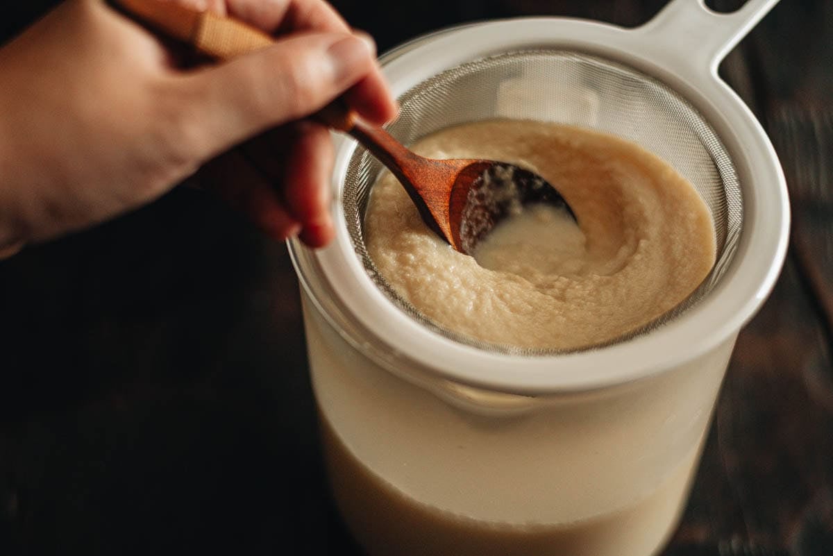 pressing the pulp with a spoon