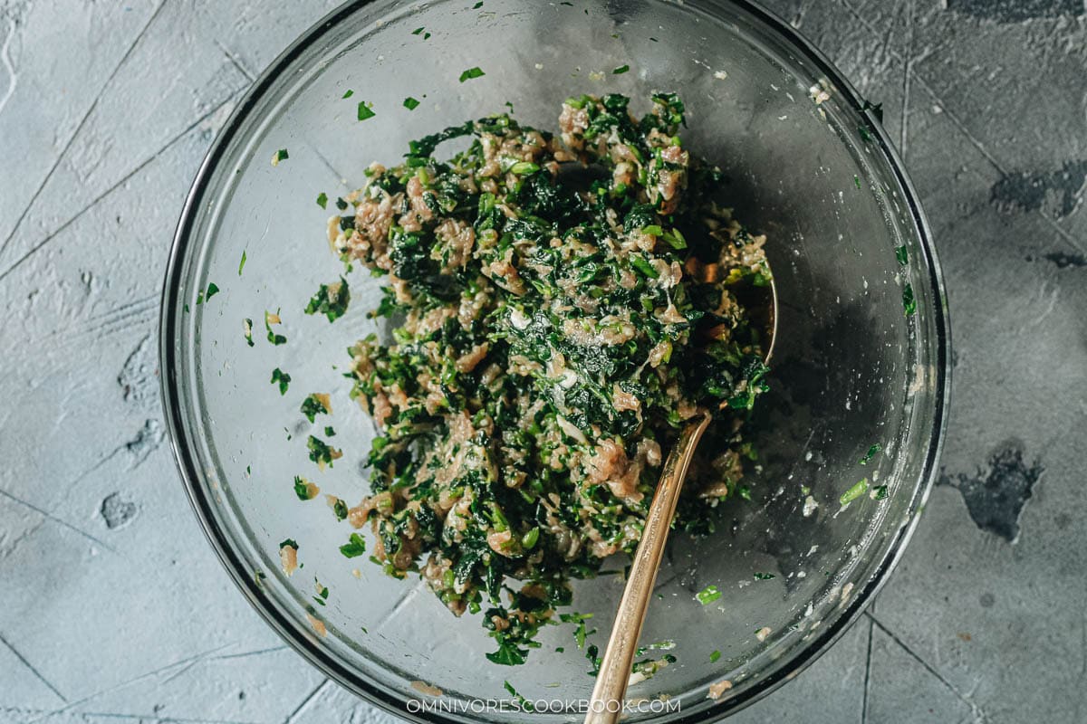 Minced watercress folded into the pork filling