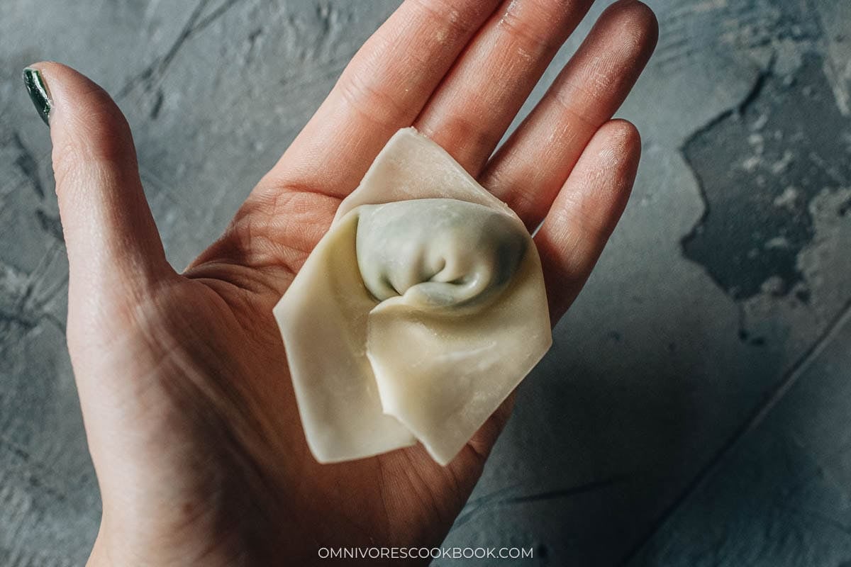 Folded watercress wontons