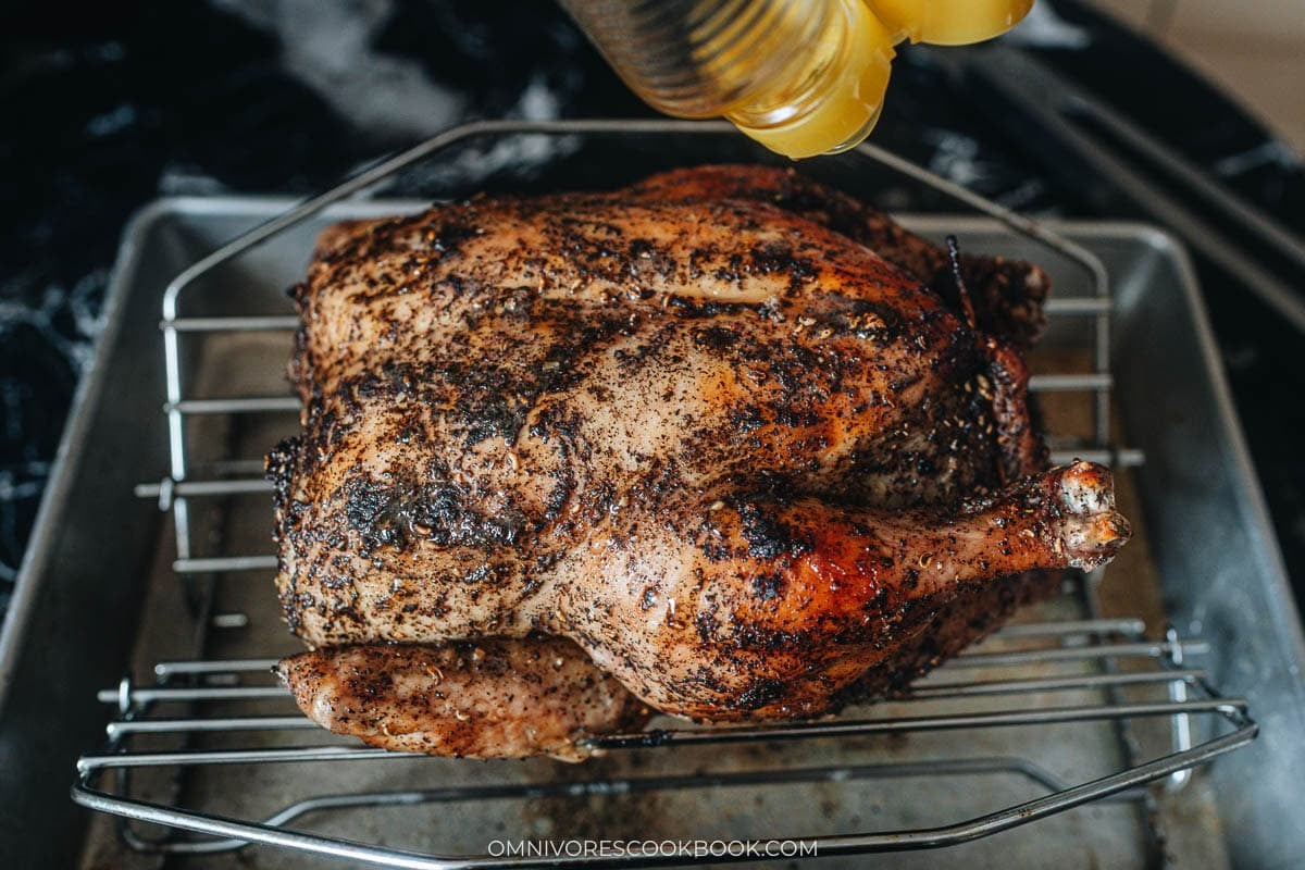 Sichuan roasted whole chicken roasting on a pan