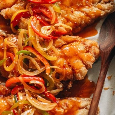 Sweet and sour mandarin fish topped with pepper and onion