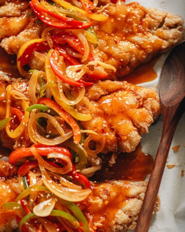Sweet and sour mandarin fish topped with pepper and onion