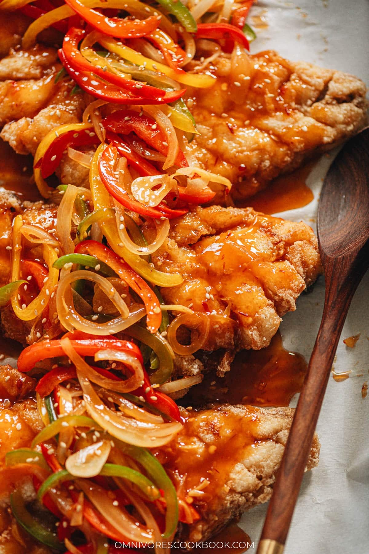 Sweet and sour mandarin fish topped with pepper and onion