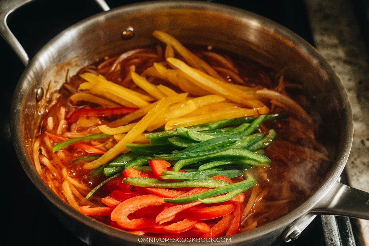 Finish up the sauce by adding peppers