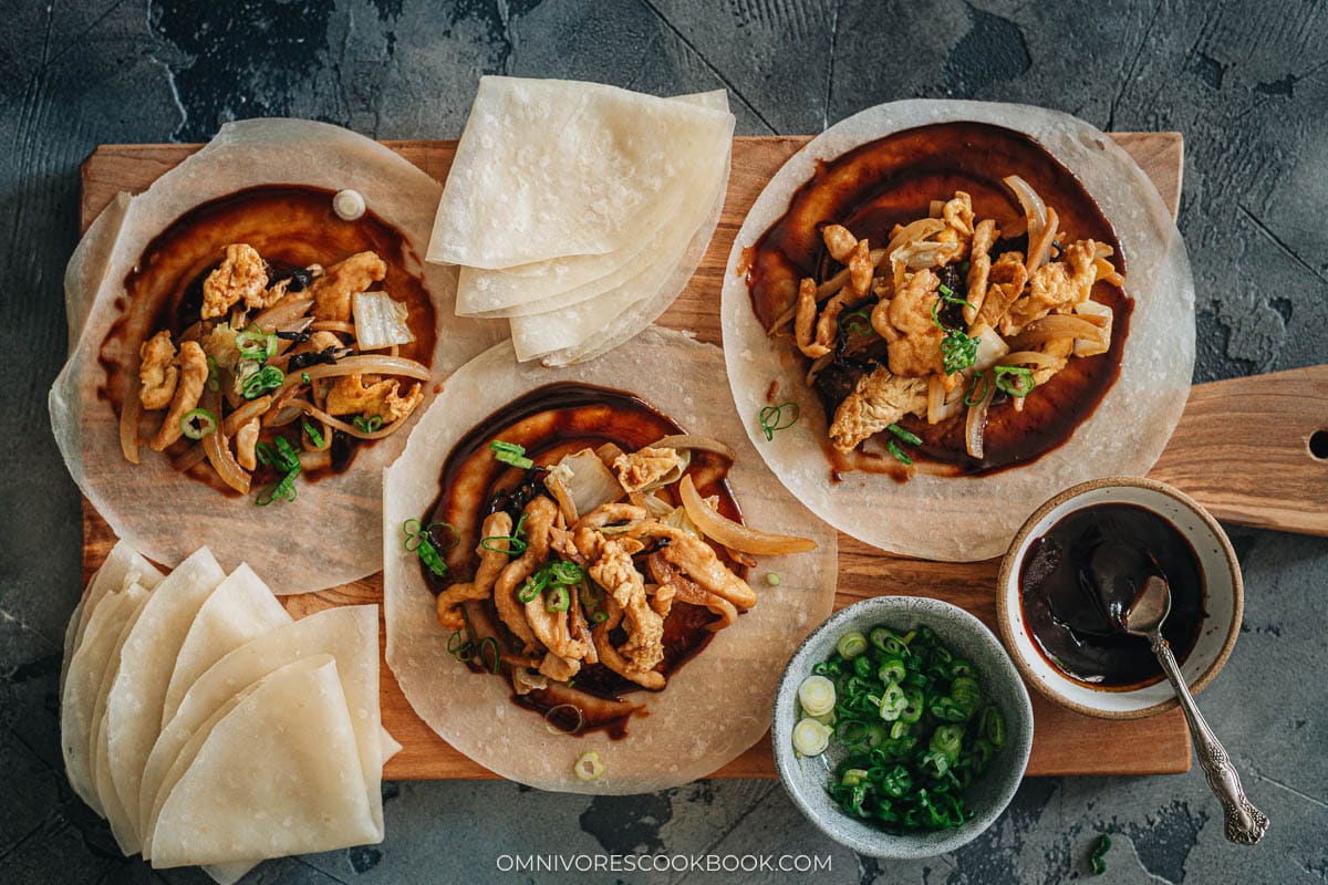 Moo shu chicken plated with steamed pancakes and extra sweet bean sauce