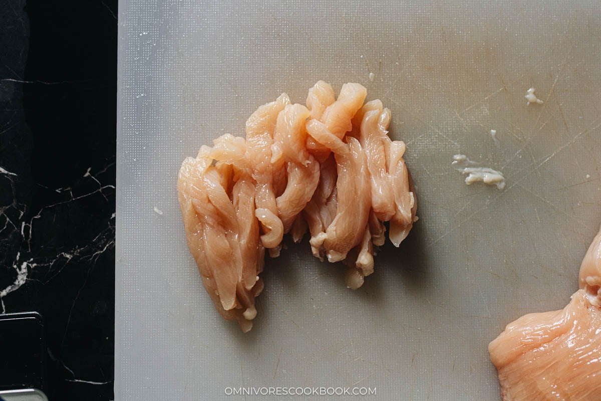 Chicken sliced into thin strips