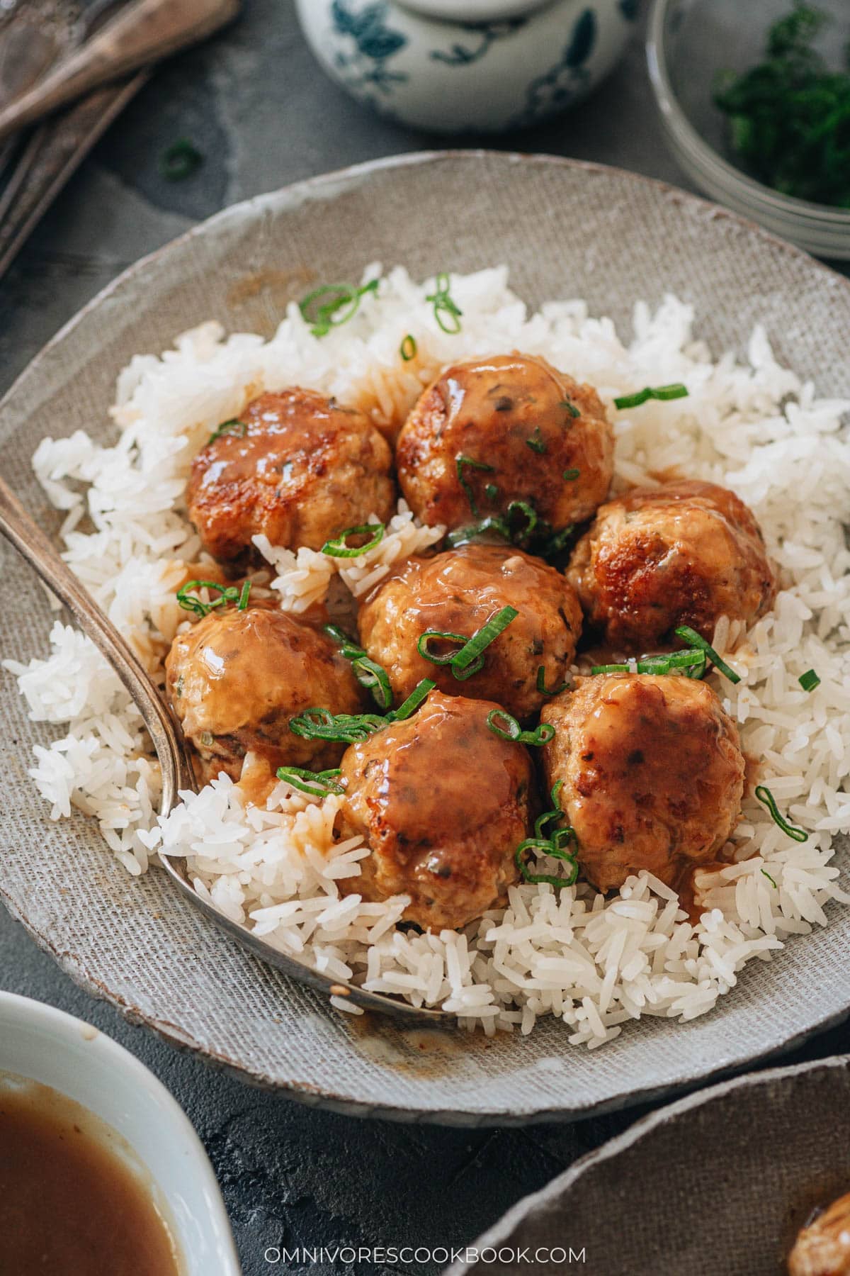 Chinese-style Instant Pot meatballs in glossy oyster sauce served over steamed rice