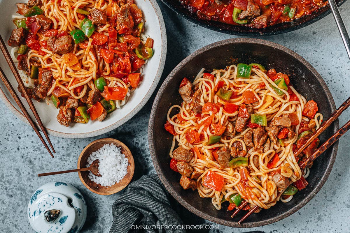Lamb sauce spooned over noodles for Uyghur style noodles with lamb sauce