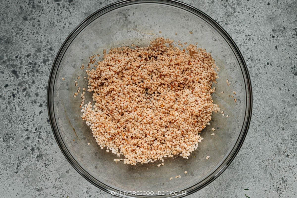 Glutinous rice rinsed and soaking in cold water in a large bowl