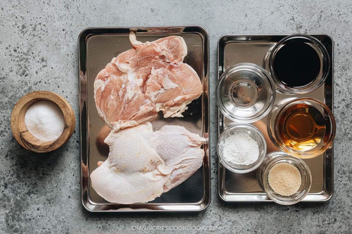 Ingredients for teriyaki chicken including skin-on chicken thigh, sake, soy sauce, mirin, sugar, and cornstarch