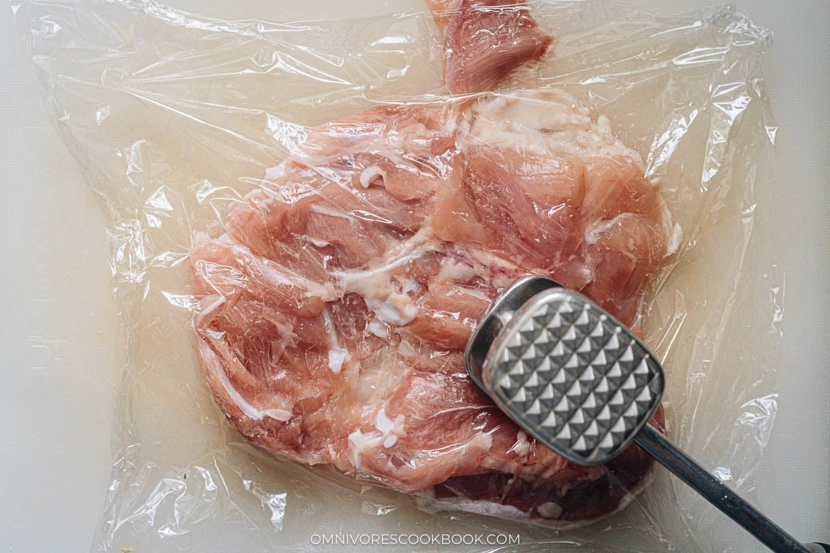 Chicken thigh pounded even and skin poked with a fork