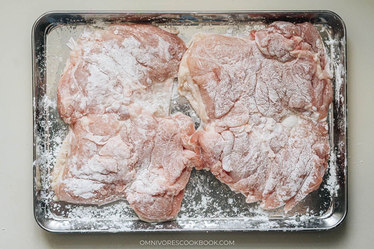Cornstarch dusted over the meat side of the teriyaki chicken thigh
