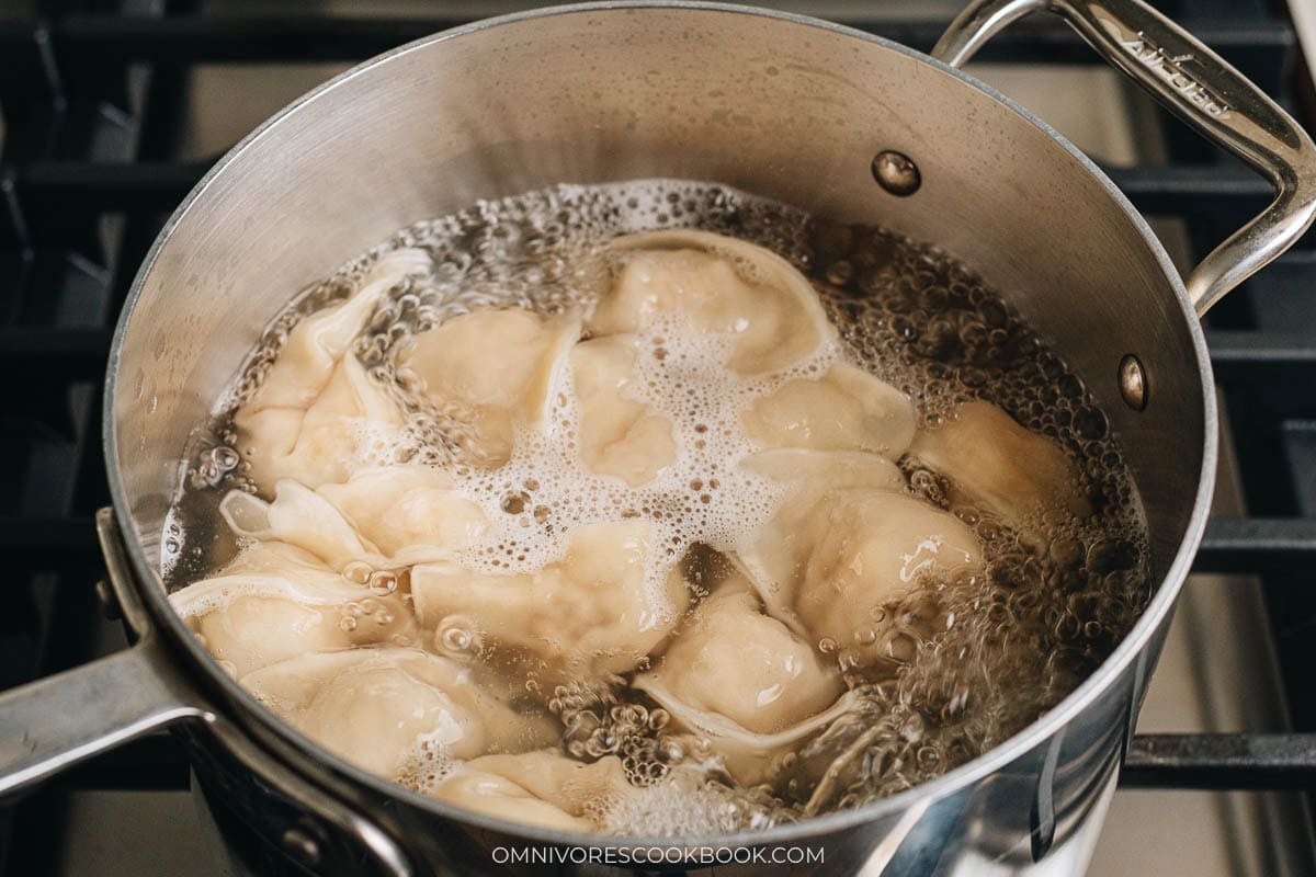Wontons floating in boiling water