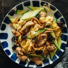 Plated moo shu pork with sliced pork, egg, and wood ear mushrooms